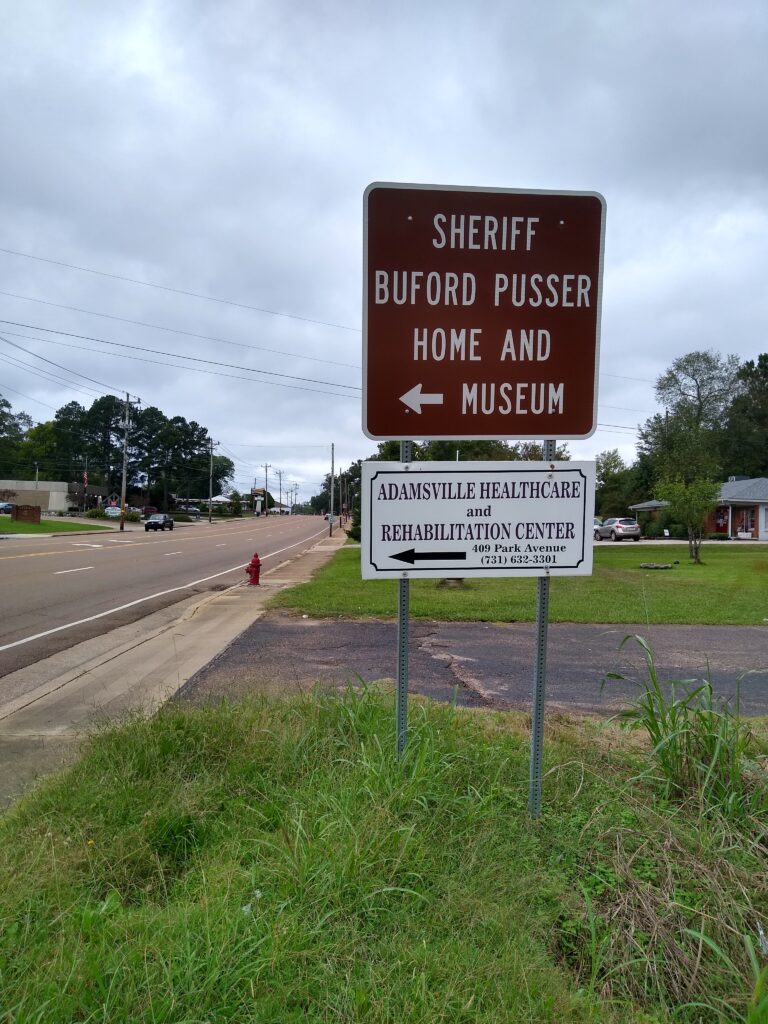 Sign in Adamsville, TN pointing out the home of Sherrif Buford Pusser