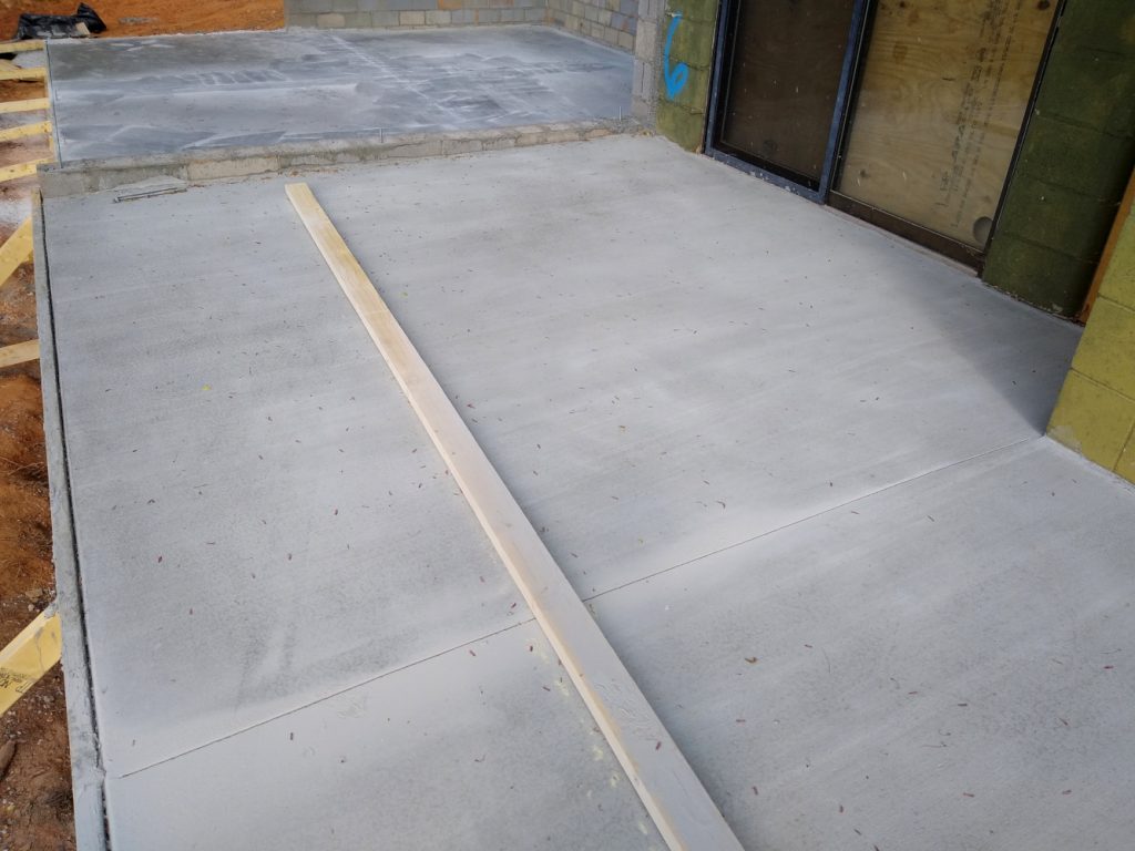 Patio slab east end with basement slab in background